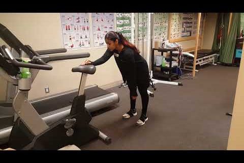 Someone demonstrating the pendulum exercise.