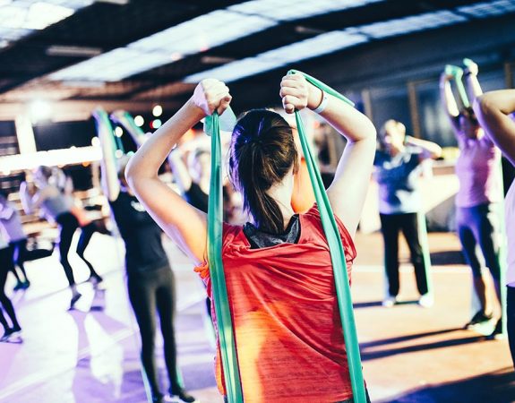 A woman exercising with an exercise band