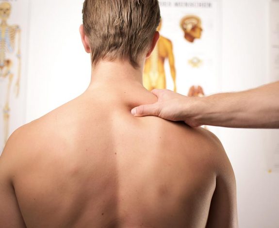 A man receiving chiropractic treatment