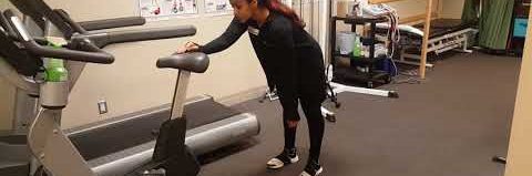 Someone demonstrating the pendulum exercise.